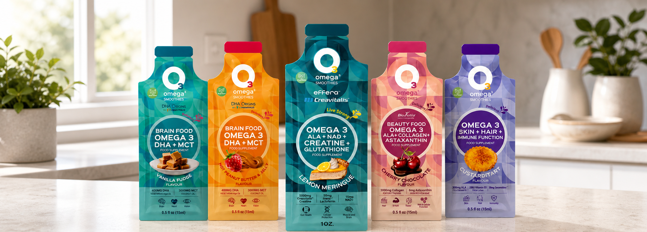 A product range of five functional O3 smoothies in colourful pouches arranged on a kitchen counter. From left: Vanilla Fudge (turquoise), Nut Peanut Butter & Jelly (orange), Lemon Meringue (dark blue, larger pack), Cherry Chocolate (pink) and Custard Tart (purple). Each pack shows the flavour name and key functional ingredients such as Omega 3, MCT, collagen and creatine.
